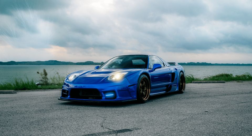 Blue widebody 1992 Acura NSX by the water